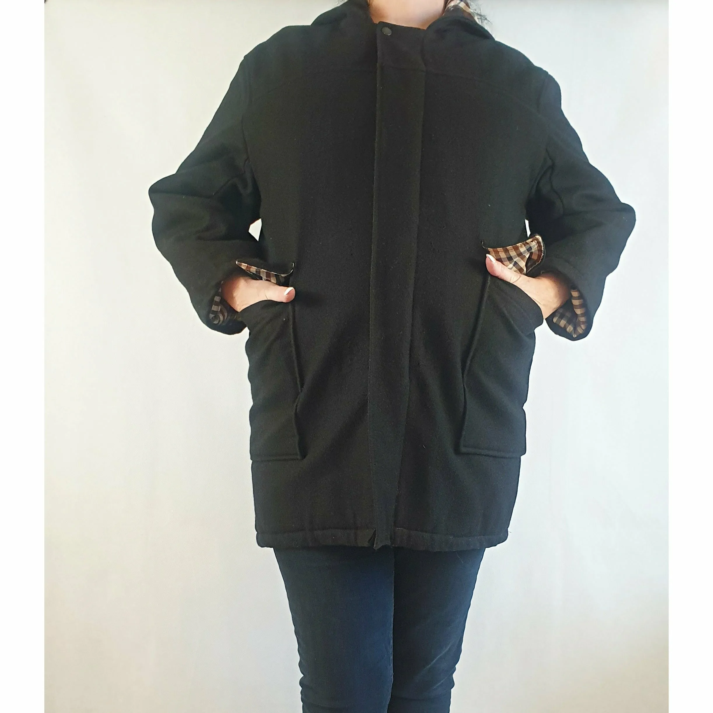 Black wool or wool mix feel coat with hood, front pockets and gingham lining - fits size 16